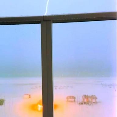 PHOTO: A bolt of lightning struck a tiki hut on a beach in Florida where a group of women took cover from the storm.