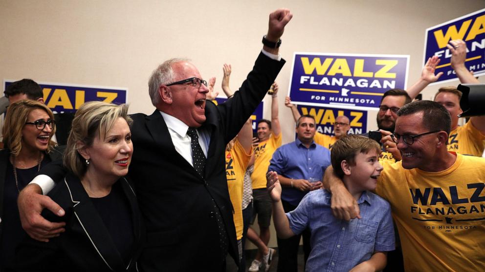 PHOTO: In this Aug. 14, 2018, file photo, candidate for governor Tim Walz, along with his wife, Gwen, greets supporters after it was announced he had won the primary during a watch party at the Carpenters Union Hall in St. Paul, Minn.