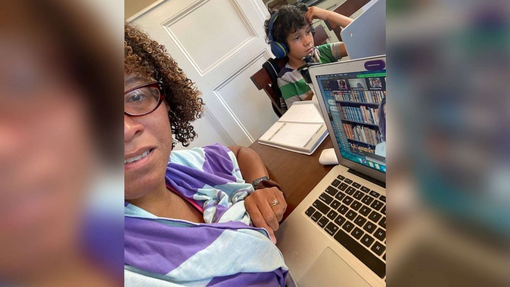 PHOTO: Tina Sherman works from home alongside her son, who is doing virtual learning.