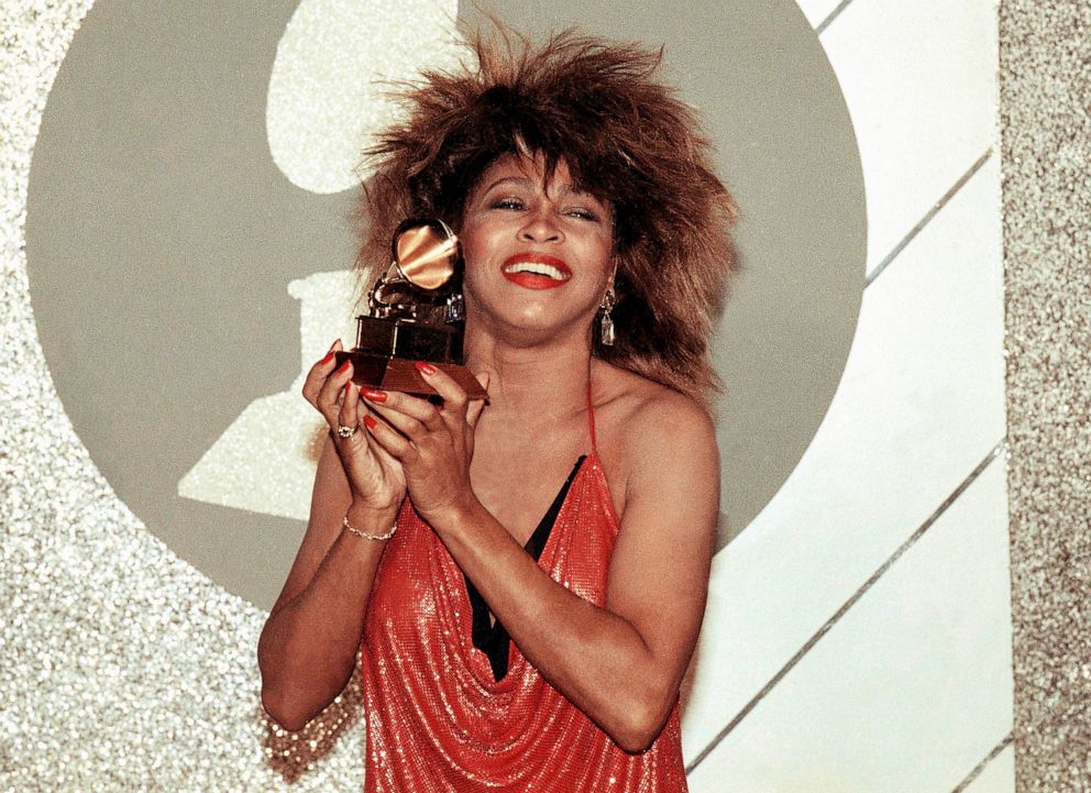 PHOTO: Tina Turner holds up a Grammy Award, Feb. 27, 1985, in Los Angeles.