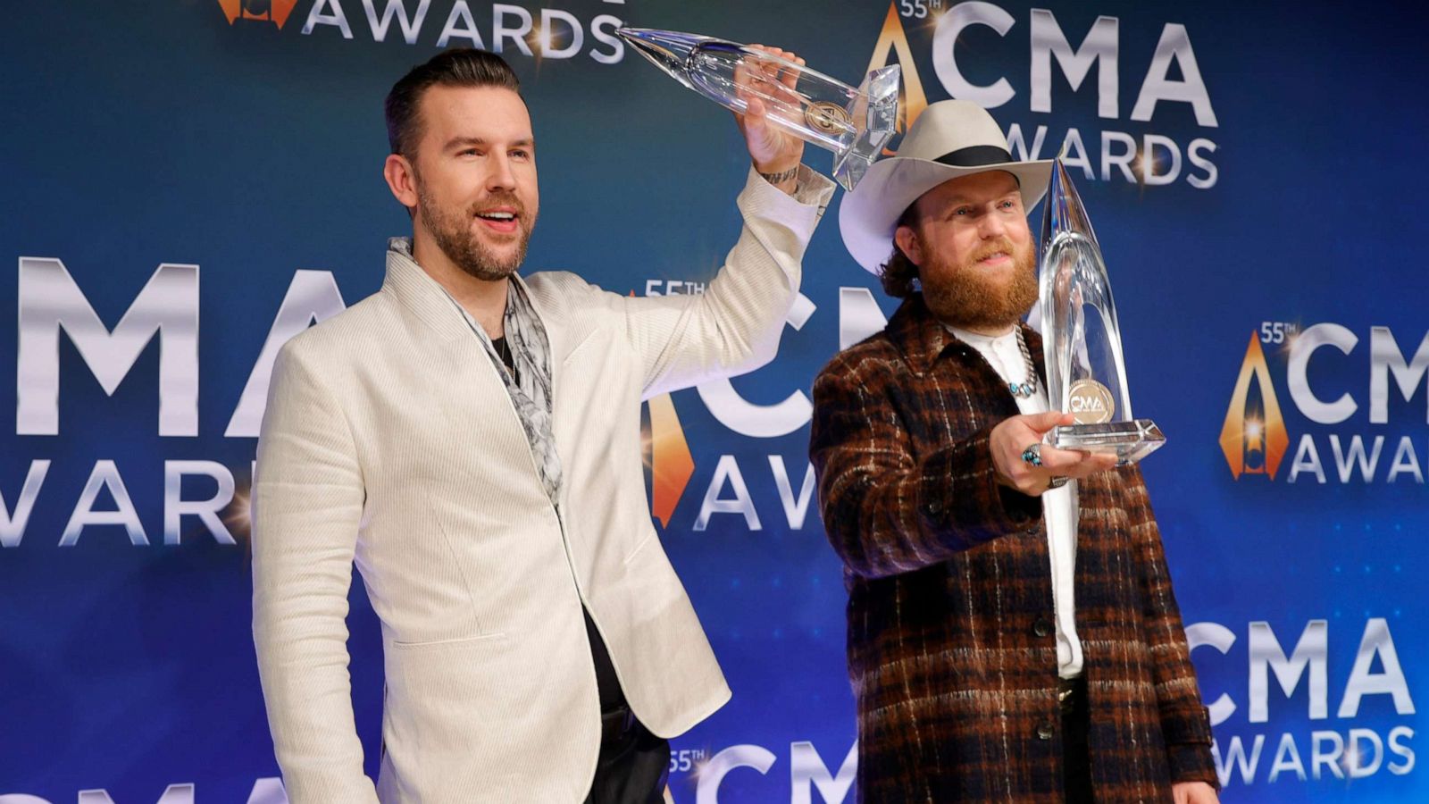 PHOTO: T.J. Osborne and John Osborne of Brothers Osborne pose with their awards for the 55th annual Country Music Association awards at the Bridgestone Arena on Nov. 10, 2021, in Nashville, Tenn.