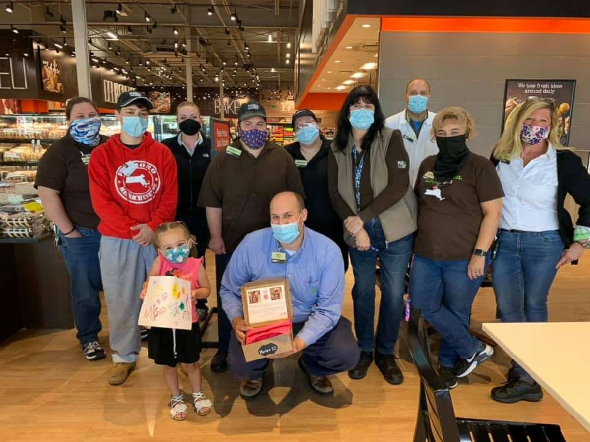 PHOTO: Mia Villa has whipped up cookies and delivers them to hospital staff, supermarket employees, veterinarians and fire and police departments in New York--all at a safe distance. Here in an undated photo, Mia stands with grocery store employees.