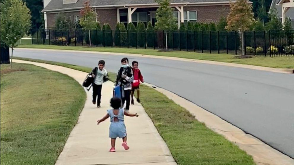 Toddler greeting her brothers after school gets viral love | GMA