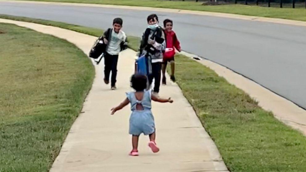 PHOTO: Emelia "Emmy" Muddamalle running to greet her three brothers Liam, Levi, and Lucas.