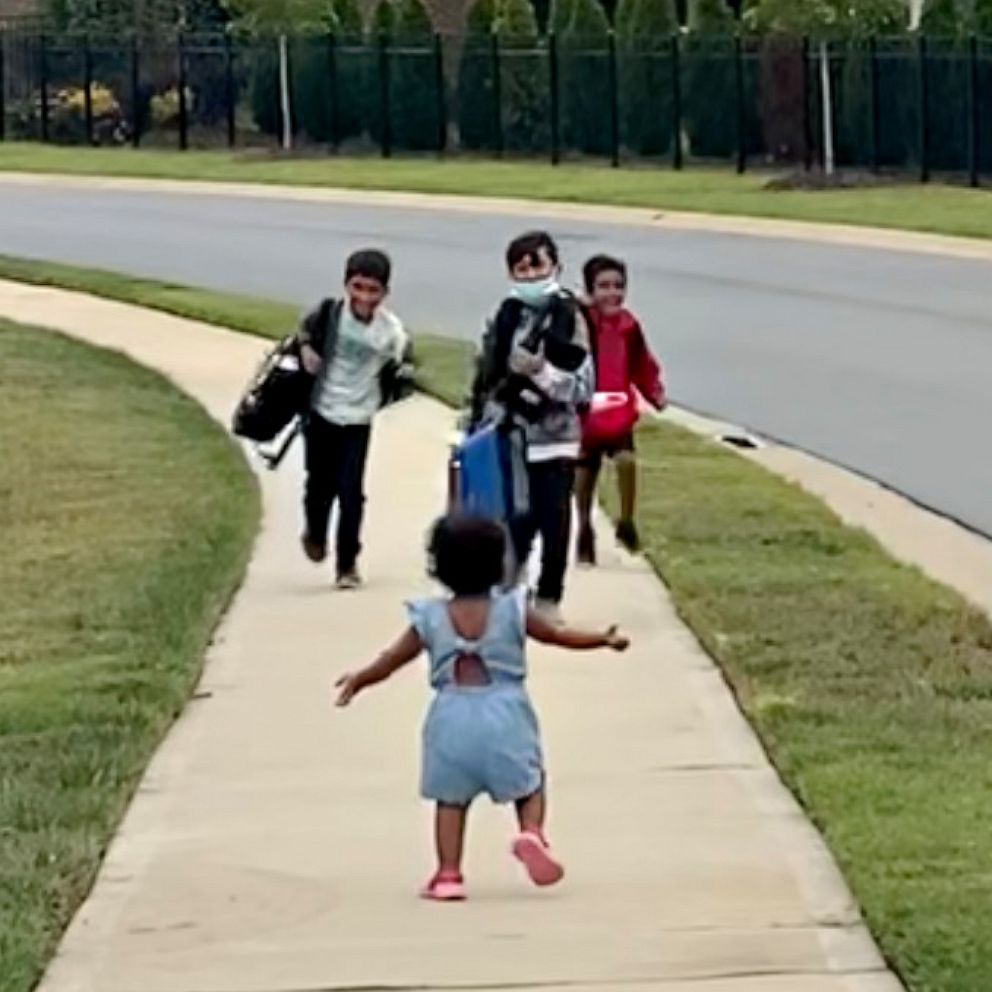 VIDEO: Little sis running to greet her big brothers after school is too cute for words