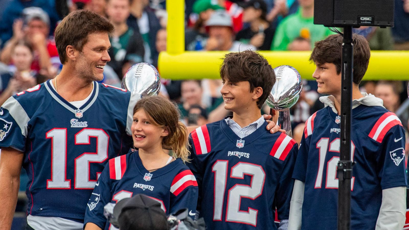 PHOTO: Tom Brady stands with his three children, Vivian, left, Benjamin, center, and Jack, during half time of the home opening game for the New England Patriots, Sept. 10, 2023, in Foxborough, Mass.