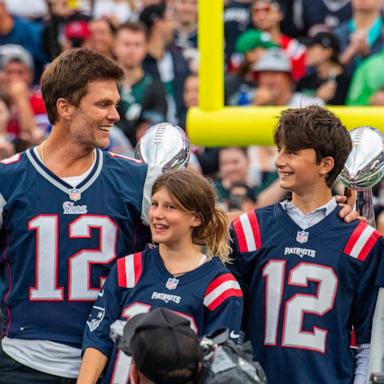 PHOTO: Tom Brady stands with his three children, Vivian, left, Benjamin, center, and Jack, during half time of the home opening game for the New England Patriots, Sept. 10, 2023, in Foxborough, Mass.