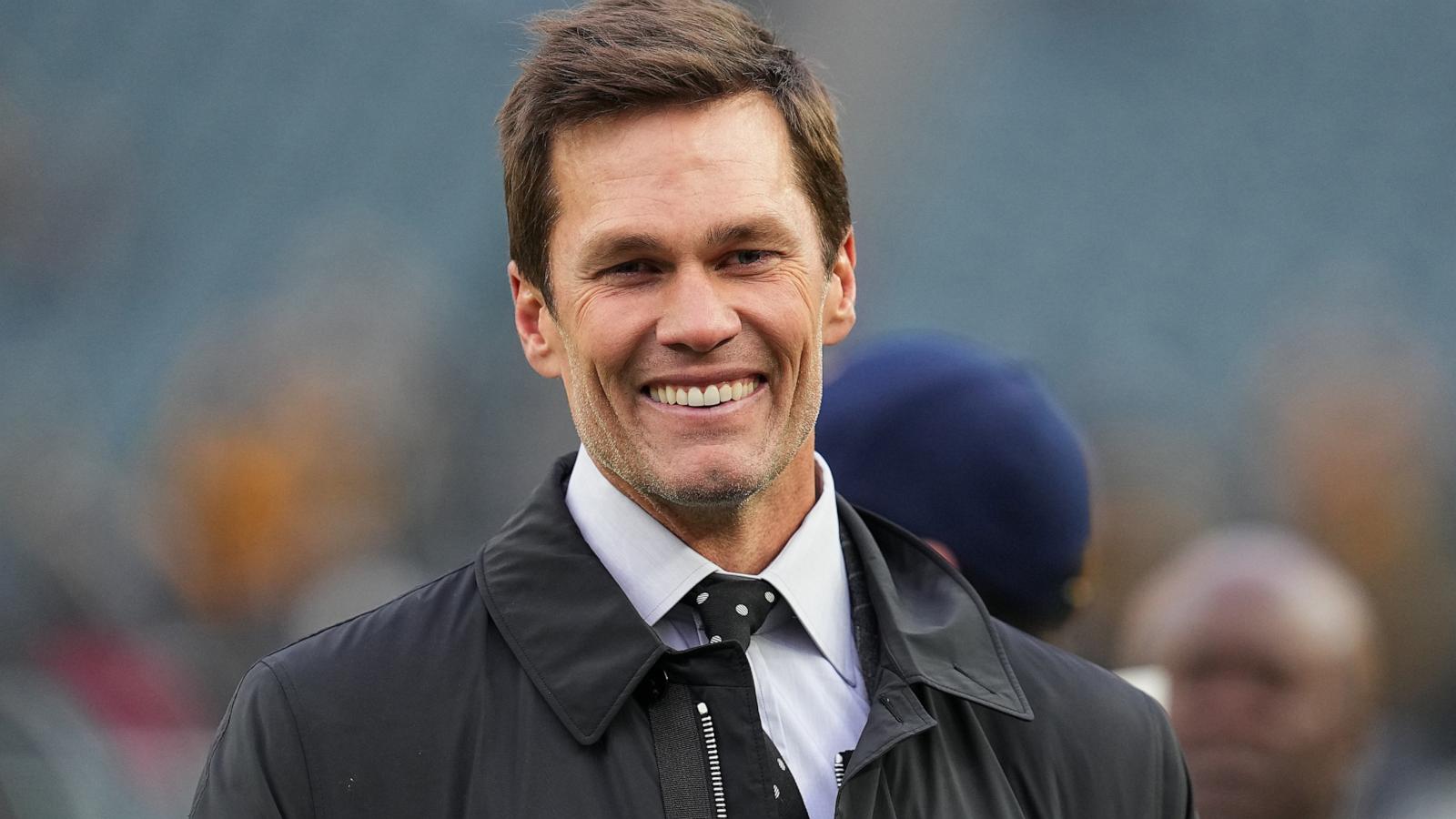 PHOTO: Tom Brady looks on from the field prior to an NFL football game between the Pittsburgh Steelers and the Philadelphia Eagles at Lincoln Financial Field on December 15, 2024 in Philadelphia, Pennsylvania.