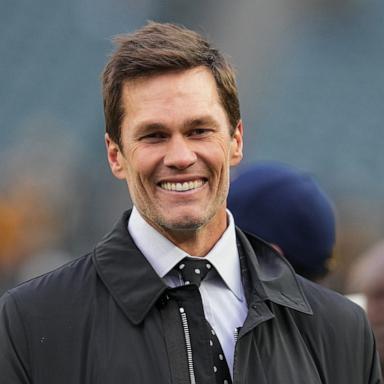 PHOTO: Tom Brady looks on from the field prior to an NFL football game between the Pittsburgh Steelers and the Philadelphia Eagles at Lincoln Financial Field on December 15, 2024 in Philadelphia, Pennsylvania.