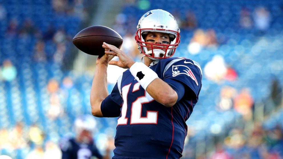 PHOTO: Tom Brady of the New England Patriots warms up for a preseason game against the Green Bay Packers, Aug. 13, 2015 in Foxboro, Mass.