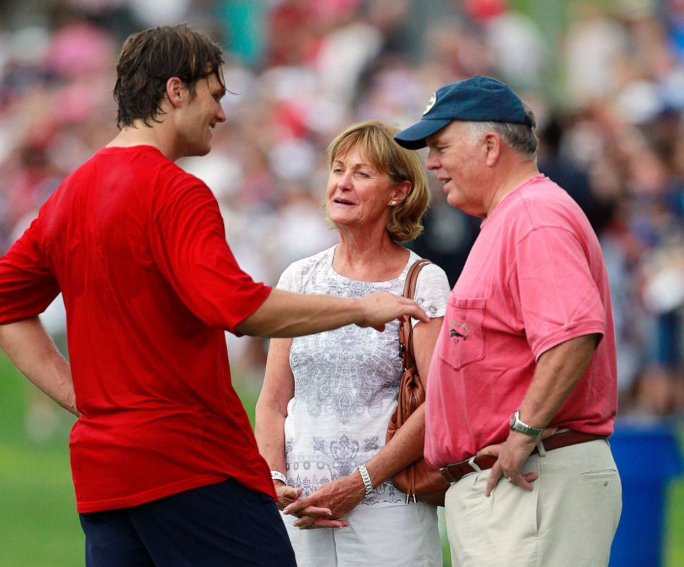 PHOTO: New England Patriots' Tom Brady, left, talks with his parents Galynn, center and Tom, after NFL football training camp in Foxborough, Mass., Aug. 9, 2011.