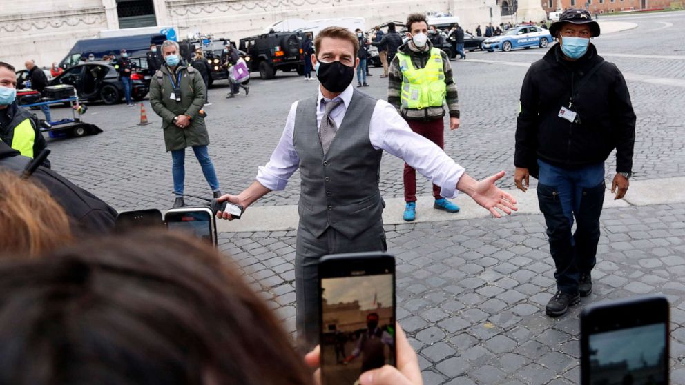 PHOTO: Tom Cruise meets with fans during a pause on the set of the film "Mission Impossible 7" on Piazza Venezia in Rome, Nov. 29, 2020.