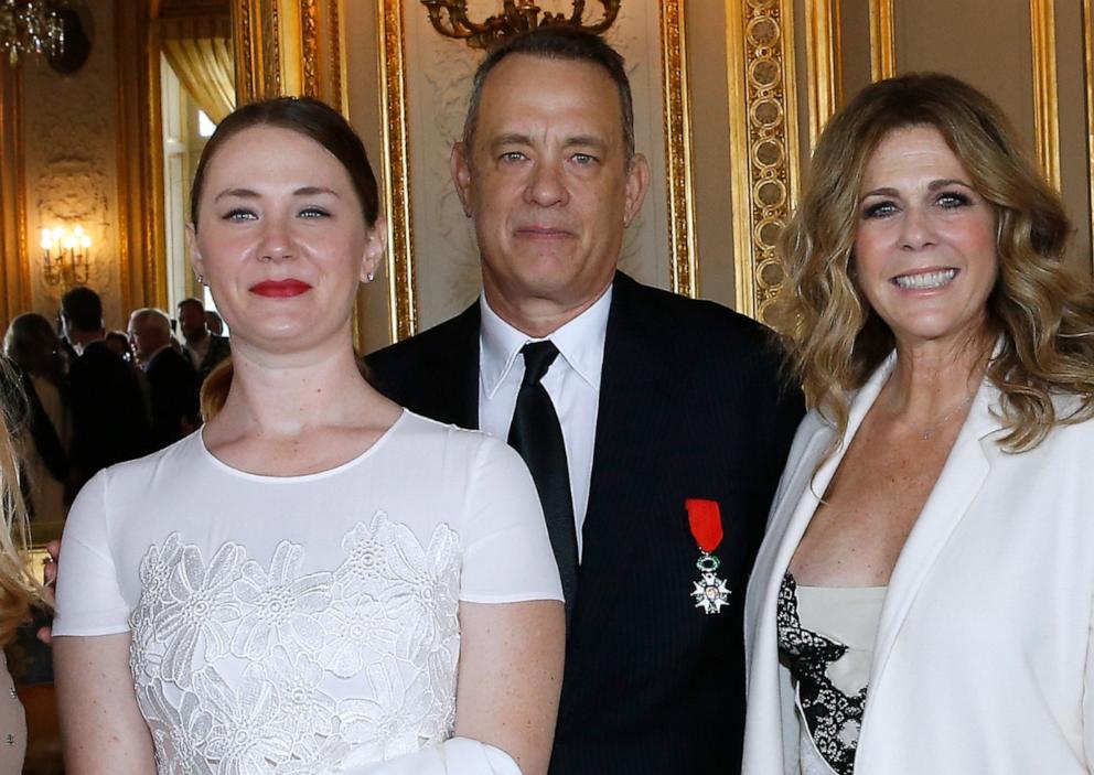PHOTO: Tom Hanks stands with his daughter Elizabeth Ann Hanks and his wife Rita Wilson as he receives the Legion d'Honneur Medal in Paris, May 19, 2016, in Paris, France. 