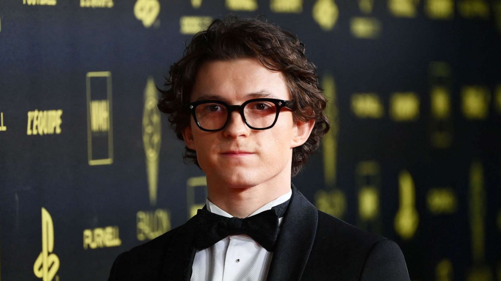 PHOTO: British actor Tom Holland poses upon arrival to attend the 2021 Ballon d'Or France Football award ceremony at the Theatre du Chatelet in Paris, Nov. 29, 2021.