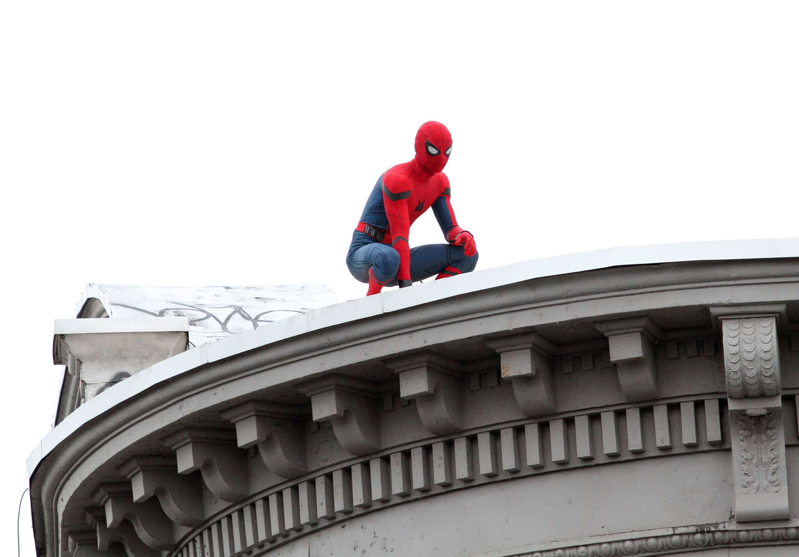 PHOTO: In this Sept. 30, 2016, file photo, Tom Holland stands on the ledge of a building in costume as he continues to shoot scenes for the upcoming movie "Spider-Man: Homecoming" in Queens, New York.