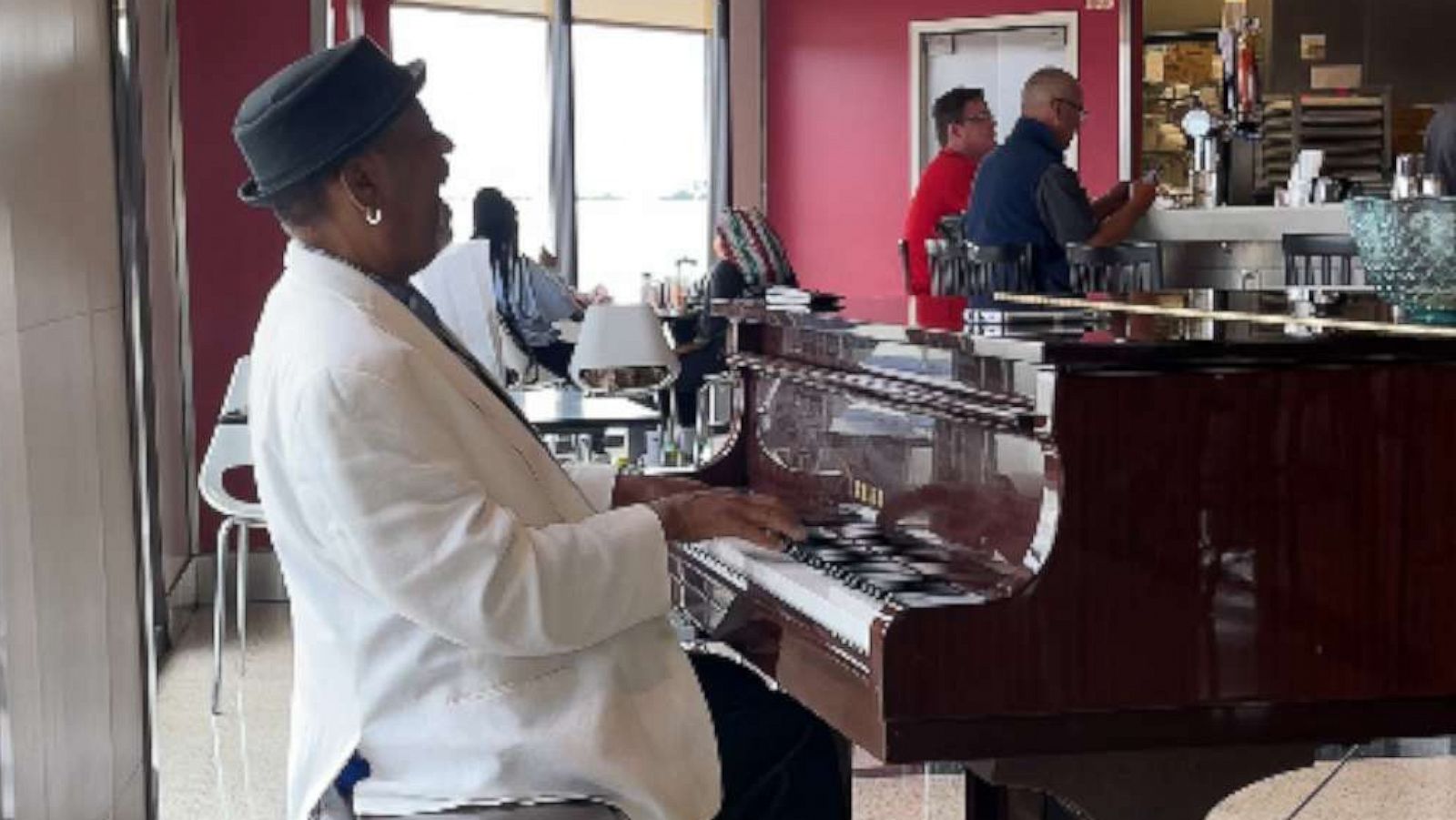 PHOTO: Tonee "Valentine" Carter plays piano in July 2021 at the Hartsfield-Jackson Atlanta International Airport in an image made from video shared by Carlos Whittaker.