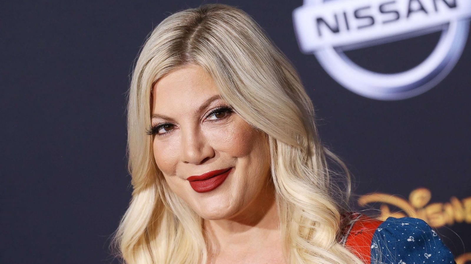 PHOTO: Tori Spelling attends the Los Angeles premiere of Disney's "Christopher Robin" held at Walt Disney Studios, July 30, 2018, in Burbank, California.