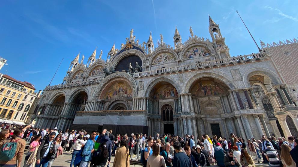 PHOTO: Tourists in Piazza San Marco in Venice, Italy.