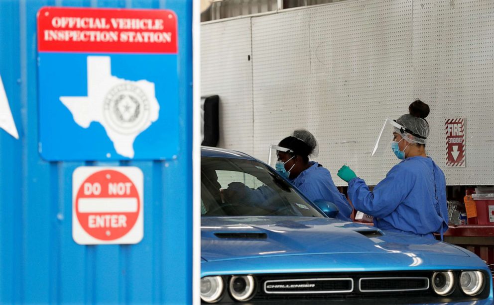 PHOTO: COVID-19 antibody testing and diagnostic testing are administered at a converted vehicle inspection station, July 7, 2020, in San Antonio, Texas. 