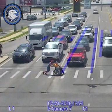 PHOTO: Christopher Hellenthal, who was dressed as Spider-Man, was caught on camera helping another man in a wheelchair cross the street on July 21, 2026.