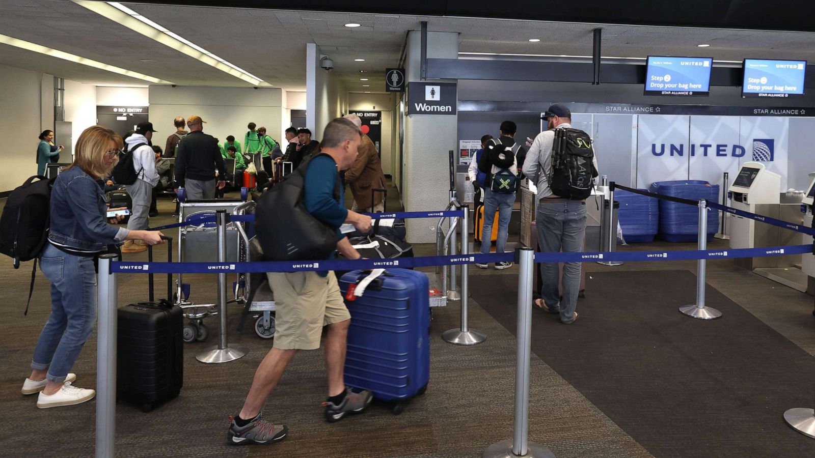 PHOTO: Customers check in for flights at San Francisco International Airport, May 12, 2022, in San Francisco.