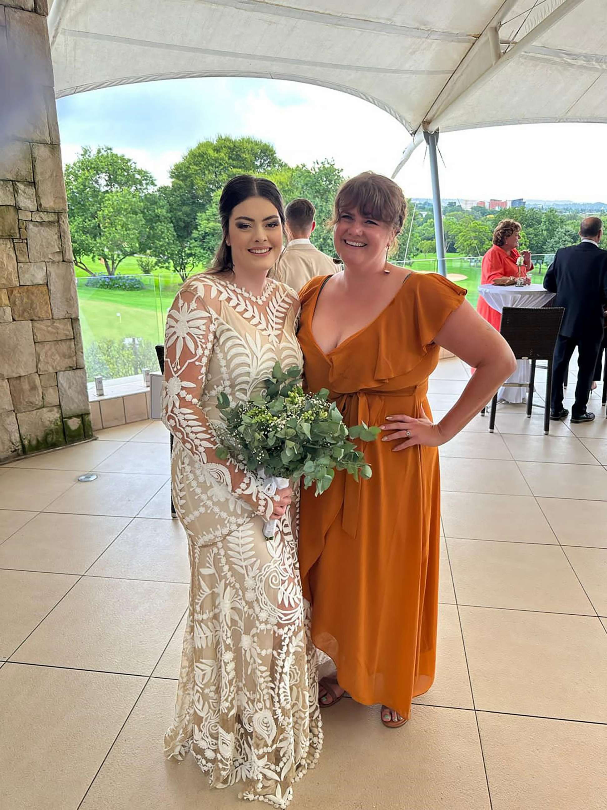PHOTO: Simone Crouch and Emily Heath smile for a photo at Crouch's wedding in Johannesburg.