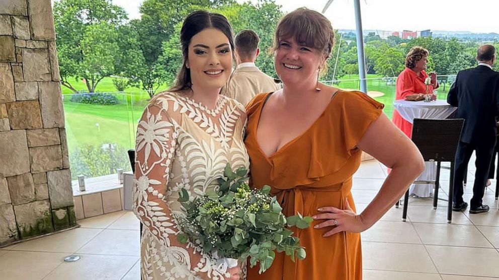 PHOTO: Simone Crouch and Emily Heath smile for a photo at Crouch's wedding in Johannesburg.