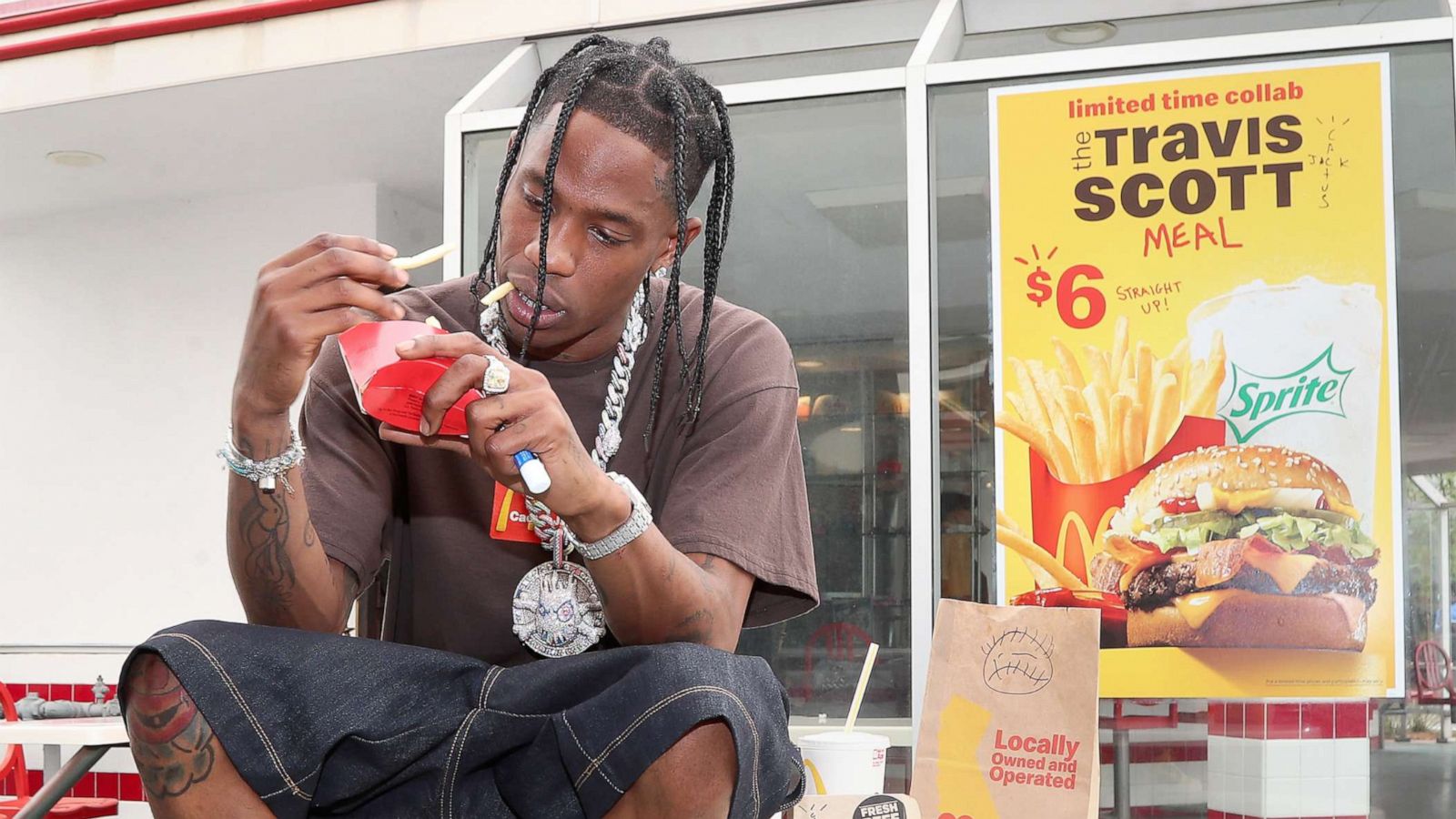 PHOTO: Travis Scott enjoys his signature McDonald's order: the Quarter Pounder with cheese, bacon and lettuce; World Famous Fries with BBQ Sauce to dip; and a Sprite.