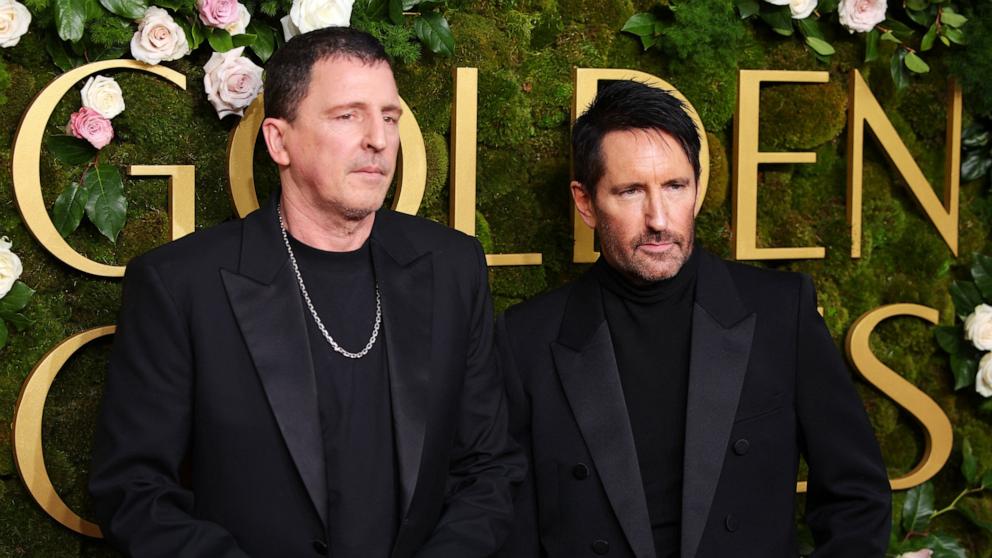 PHOTO: Atticus Ross and Trent Reznor attend the 82nd Golden Globe Awards, Jan. 5, 2025, in Beverly Hills, Calif.