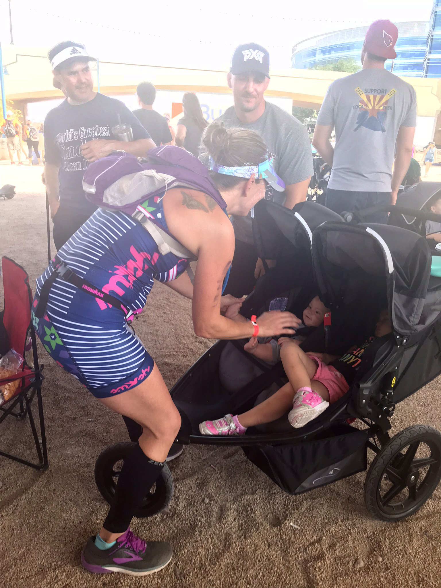 PHOTO: Jaime Sloan stops to see her children at the Ironman 70.3 in Tempe, Arizona.