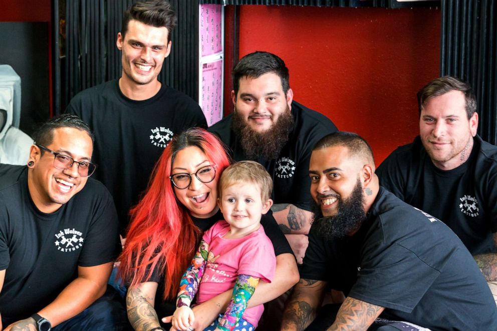 PHOTO: Trinity D'Autorio, 3, is seen in a recent photo with the staff at Ink Wolves tatooo shop in Tampa, Fla.