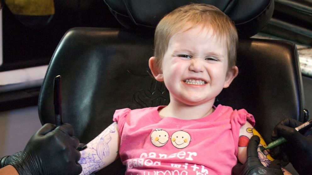 PHOTO: Trinity D'Autorio, 3, received temporary tattoos at Ink Wolves tattoo shop in Tampa, Fla., since she loves looking at her father's tattoos. 