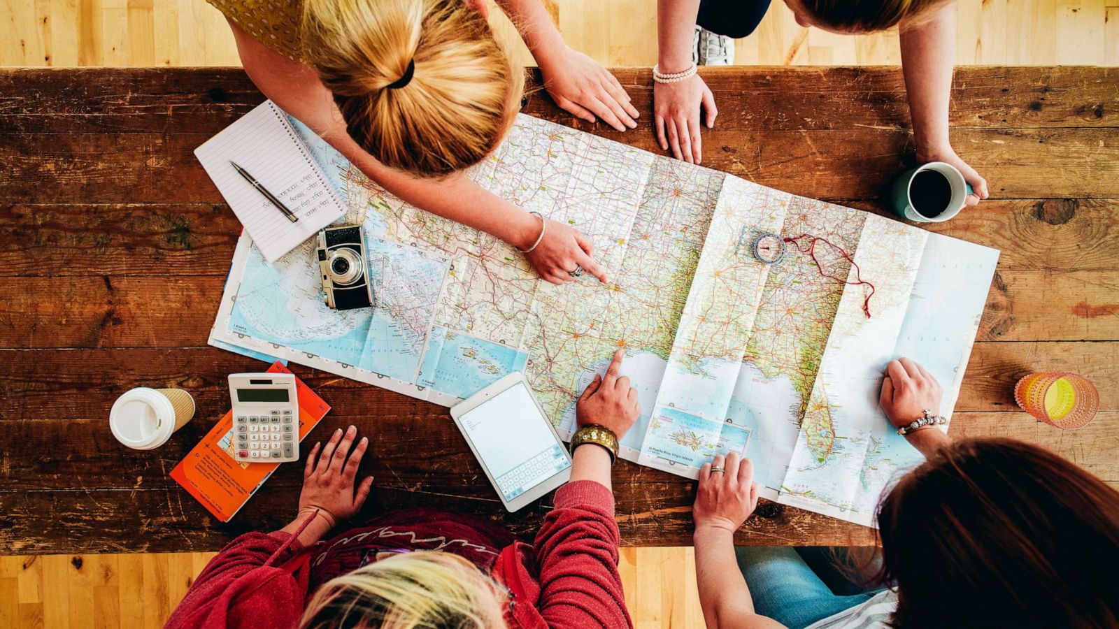 PHOTO: An undated stock photo depicts women planning a trip together.