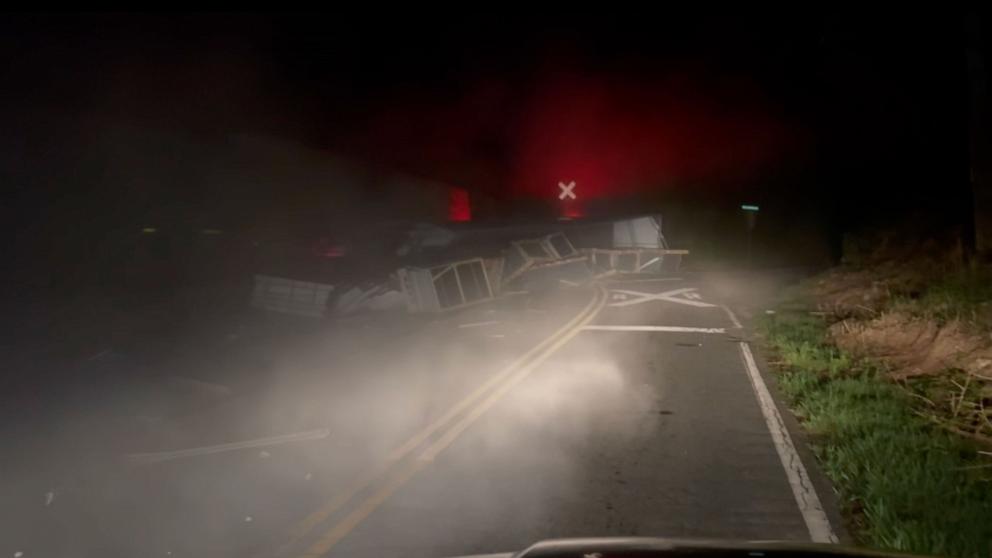 PHOTO: A tractor-trailer driver narrowly escaped a train collision in Georgia.