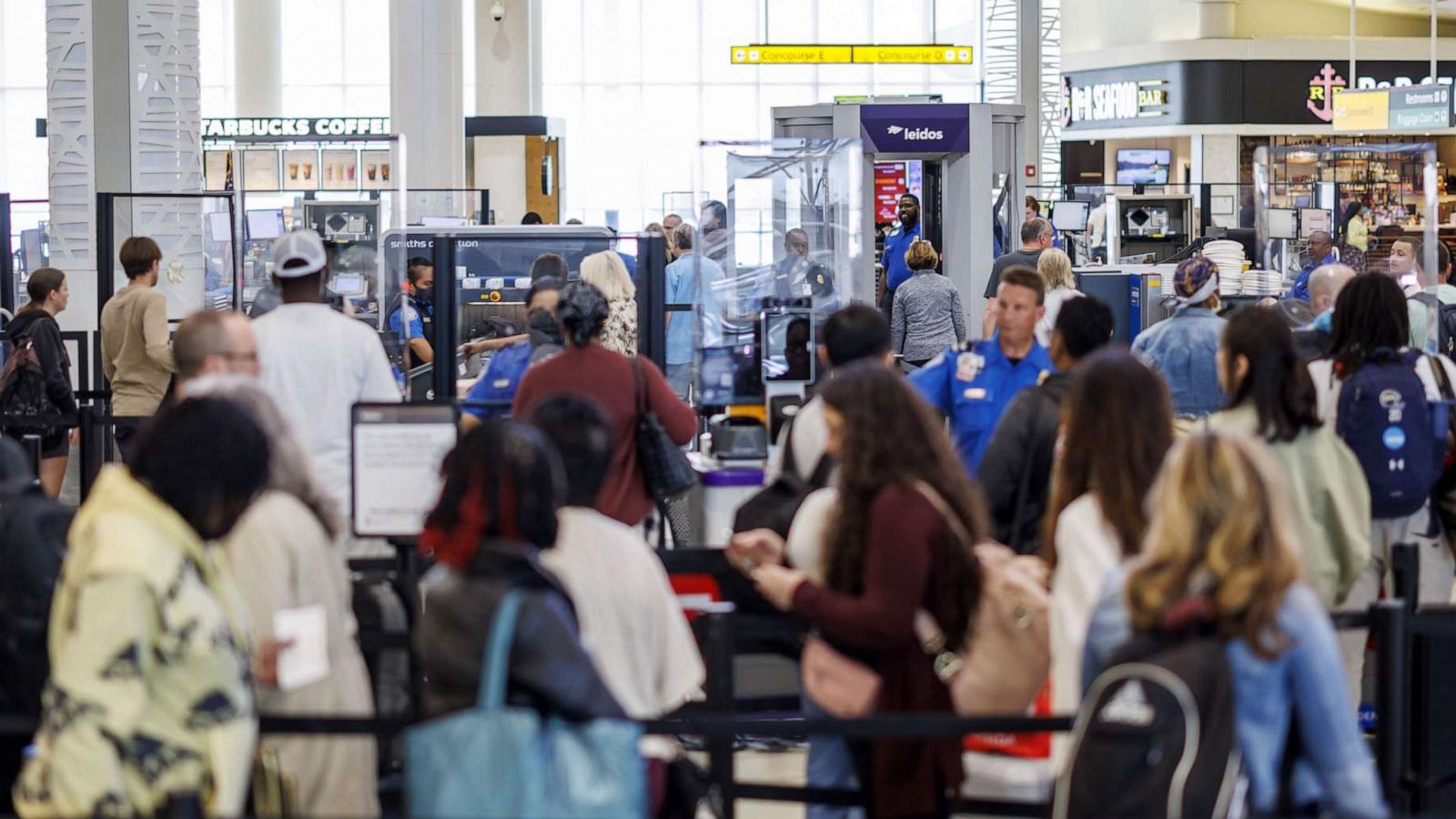 PHOTO: Departing travelers wait at a Transportation Security Administration (TSA) security checkpoint at Baltimore-Washington Airport (BWI) in Baltimore, Maryland, April 26, 2023.