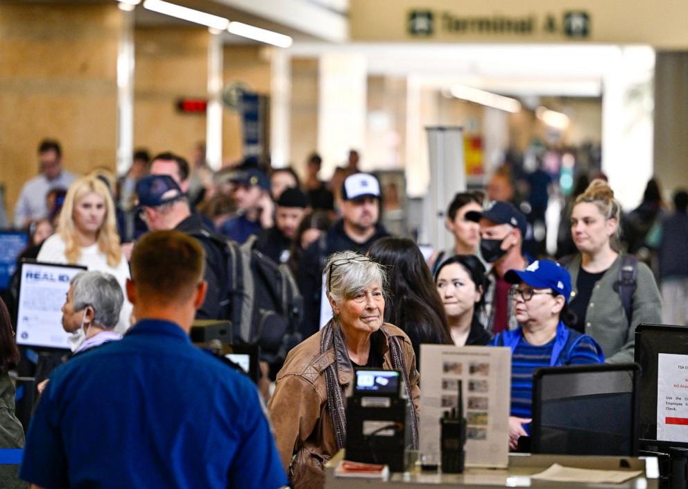 PHOTO: Air travelers go though TSA security at John Wayne Airport in Santa Ana, CA, May 7, 2025.