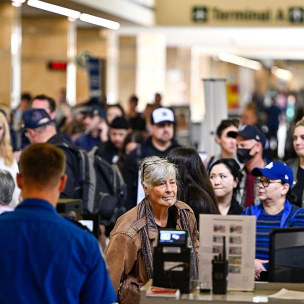 Air travelers go though TSA security at John Wayne Airport in Santa Ana, CA, May 7, 2025.