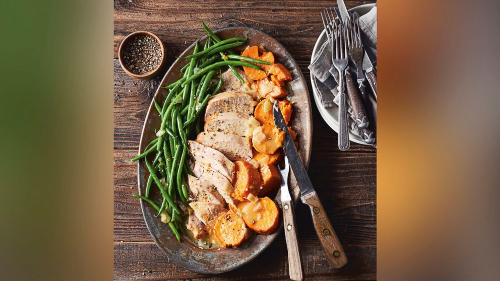 Turkey breast with sweet potatoes, green beans and gravy are pictured from the cookbook "Skinnytaste One & Done" by Gina Homolka.