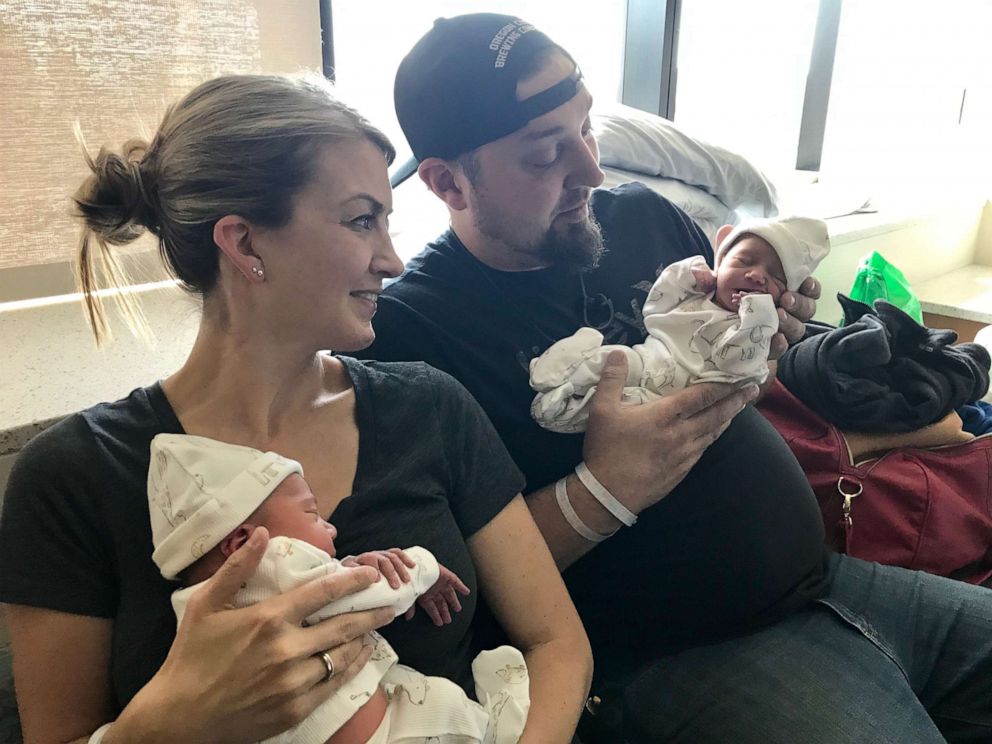 PHOTO: Whitney and Peter Bliesner of Oregon, hold their children, Rhett and Rhenley afer Bliesner's sister carried the children for the couple. 