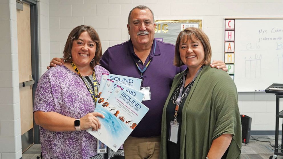 PHOTO: Twins, Becky Bush and Sarah Lenhart, right, have followed their dad Bob Phillips, a retired teacher, into music education.