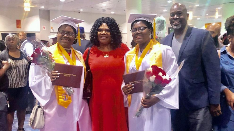 PHOTO: Tyra and Tia Smith, 18, are seen with their parents, Lemi-Ola Erinkitola and Terry Smith Sr. at the Lindblom Math and Science Academy graduation in West Englewood, Ill., on June 8, 2019.