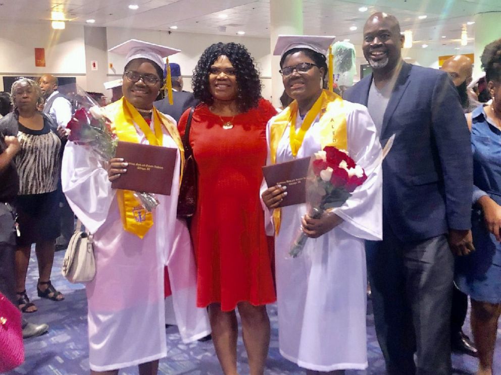 PHOTO: Tyra and Tia Smith, 18, are seen with their parents, Lemi-Ola Erinkitola and Terry Smith Sr. at the Lindblom Math and Science Academy graduation in West Englewood, Ill., on June 8, 2019.