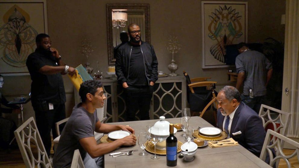 PHOTO: Tyler Perry watches a scene starring Geoffrey Owens in "The Haves and the Have Nots."