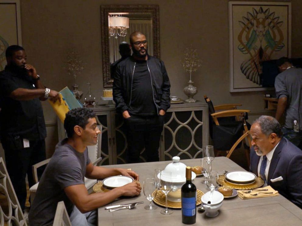 PHOTO: Tyler Perry watches a scene starring Geoffrey Owens in The Haves and the Have Nots.