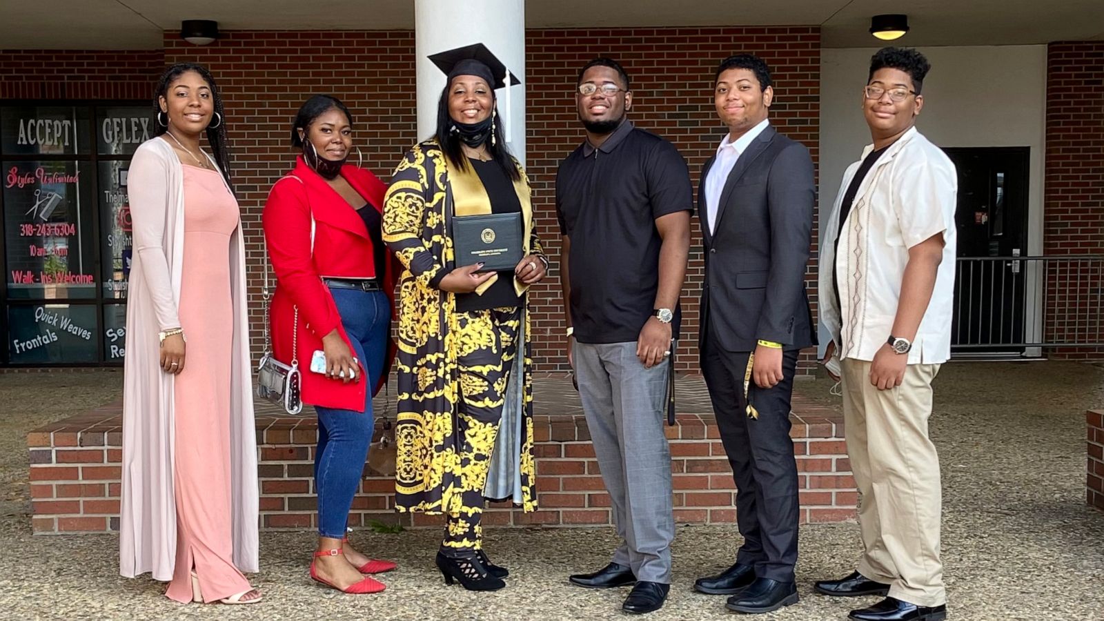 PHOTO: Tyra Muhammad, 46, poses with her five children on the day of her graduation from Grambling State University.