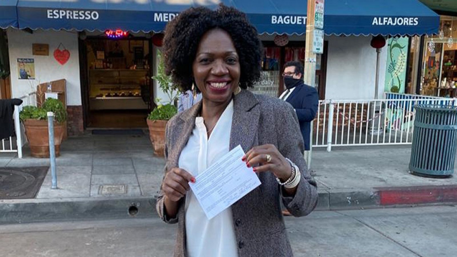 PHOTO: Evelyn Uba, a California mother of four, holds up a card of oath after her swearing-in ceremony in January 2021.