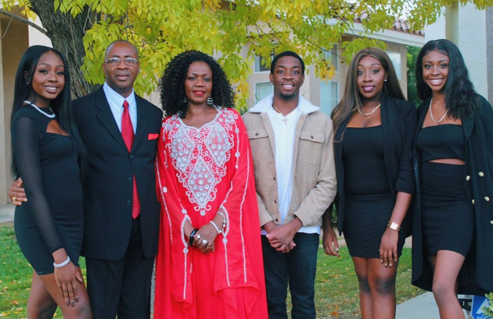 PHOTO:Evelyn Uba, her husband and four children gather for a family photo.