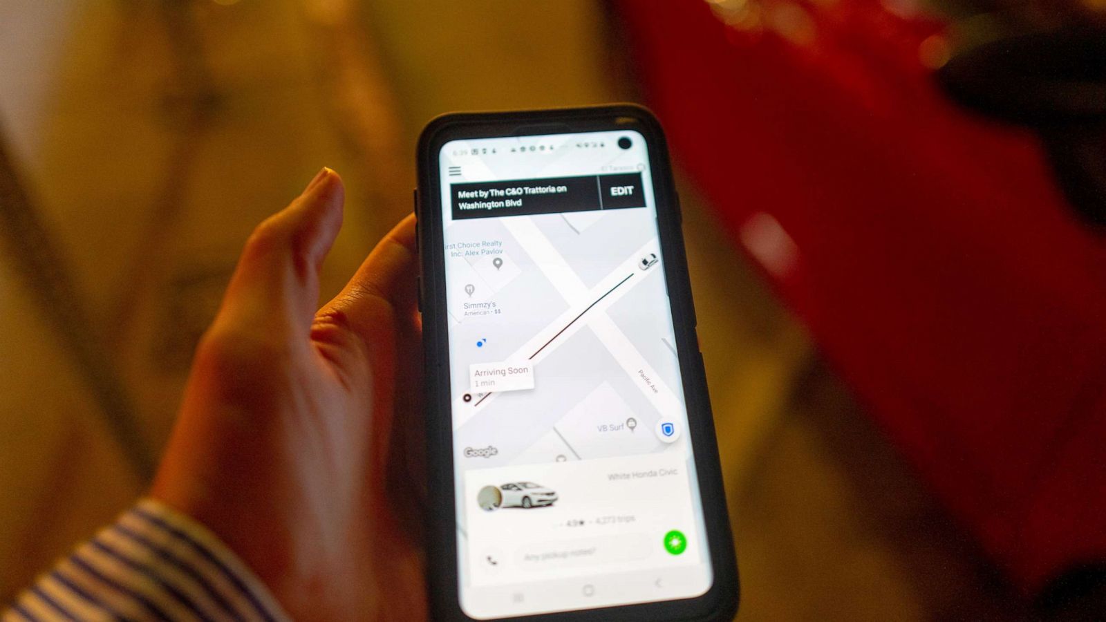 PHOTO: A person uses the Uber app to hail an Uber ride-sharing vehicle in Los Angeles, Oct 27, 2019.