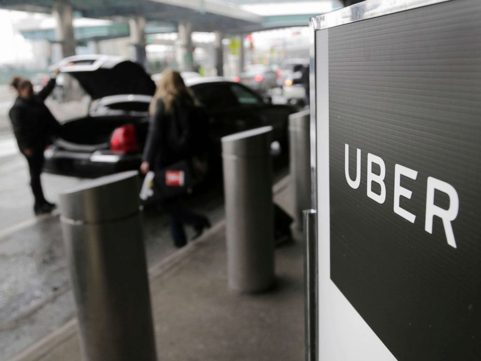 PHOTO: A sign marks a pick up point for the Uber car service at LaGuardia Airport in New York, March 15, 2017.