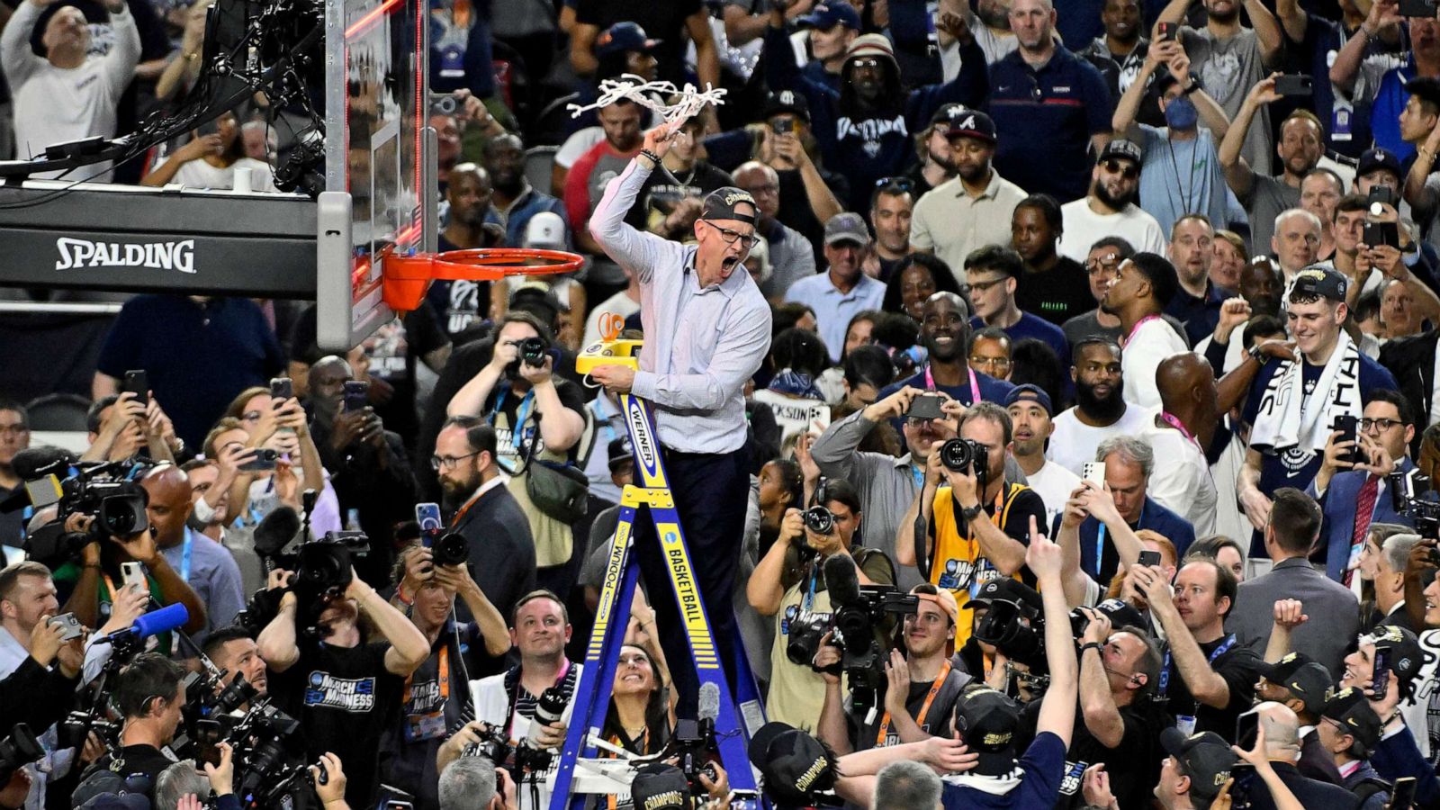 PHOTO: Head coach Dan Hurley of the Connecticut Huskies reacts as he cuts down the net after defeating the San Diego State Aztecs 76-59 during the NCAA Men's Basketball Tournament National Championship game at NRG Stadium, April 03, 2023 in Houston.